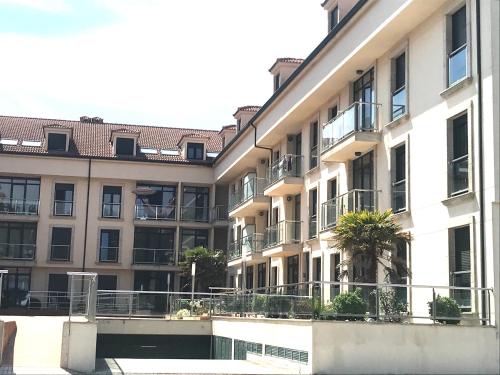 an apartment building with balconies and a courtyard at Fisterracons in Finisterre