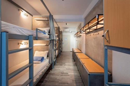 
a room with two bunk beds in it at Bedbox Hostel in Athens
