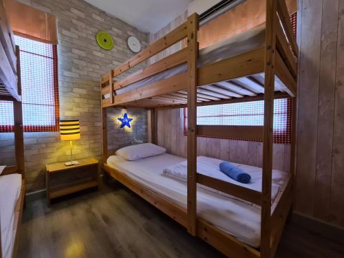 Krevet ili kreveti na kat u jedinici u objektu AMARA Pool Villa at Boulevard Tuscany Cha Am - Hua Hin