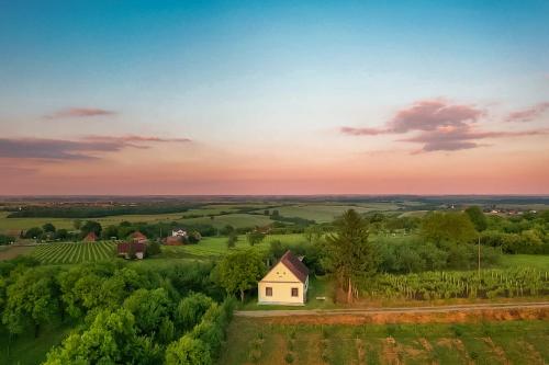an aerial view of a white house in a field at Village Wine House in Mandićevac