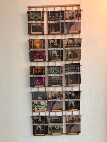 a bunch of dvds are on a wall at Hotel Credible in Nijmegen