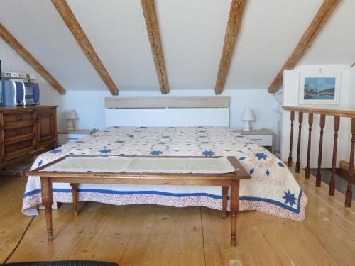 a bedroom with a bed and a wooden floor at Ustrine view in Ustrine