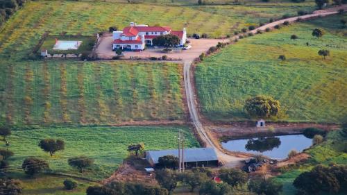 an aerial view of a house in a field at Herdade Dos Barros in Terena