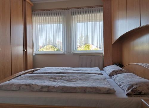 Säng eller sängar i ett rum på Fewo am Sassenberg