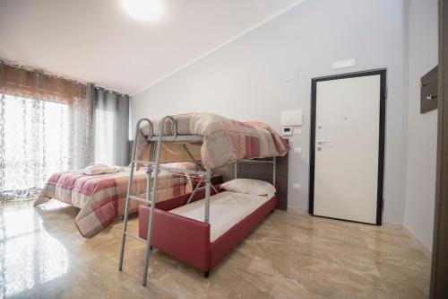 a bedroom with a bunk bed and a mirror at B&B Il Risveglio del Cavaliere in Gioia dei Marsi
