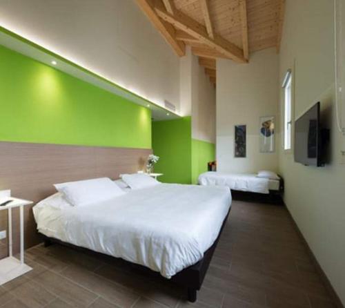 Postel nebo postele na pokoji v ubytování Hotel Marelet