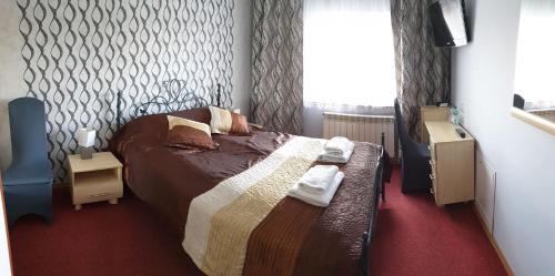 Katil atau katil-katil dalam bilik di Hotel Bursztynowy