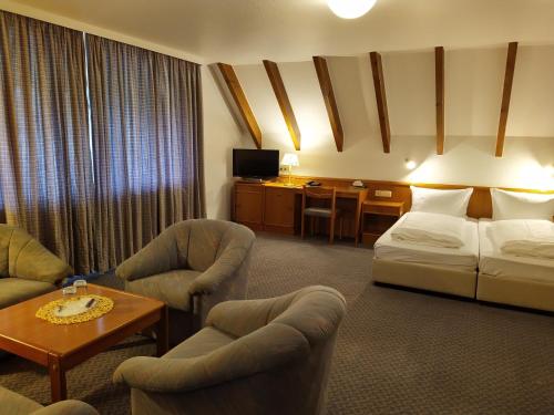 Postel nebo postele na pokoji v ubytování Hotel Faller
