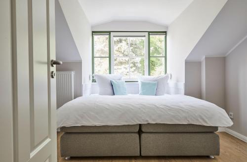 Un pat sau paturi într-o cameră la Villa Fortuna