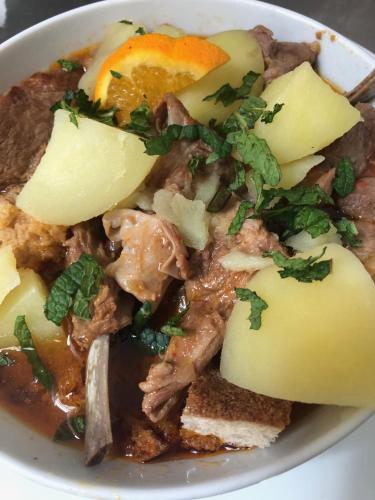 a white bowl of food with meat and vegetables at Varanda Do Alentejo in Marvão