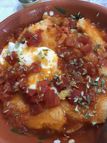 a bowl of food with tomatoes and cheese on it at Varanda Do Alentejo in Marvão
