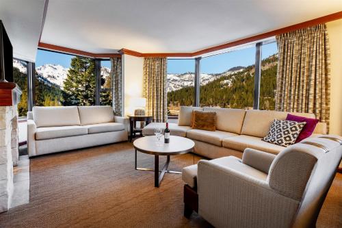 a living room with a couch and a table at Everline Resort and Spa, Lake Tahoe in Olympic Valley