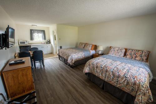 Ένα ή περισσότερα κρεβάτια σε δωμάτιο στο Pacific City Inn