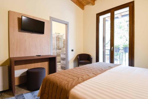 Postel nebo postele na pokoji v ubytování Agriturismo Ippolita Lucchetti