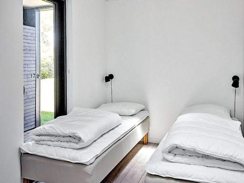 Кровать или кровати в номере Holiday home Sjællands Odde XII