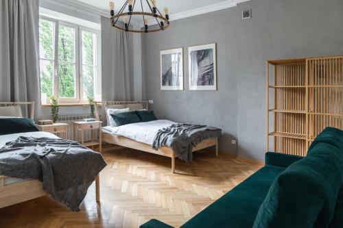 Posteľ alebo postele v izbe v ubytovaní Warsaw Concierge Filtrowa