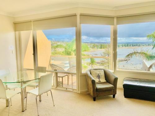 
a living room filled with furniture and a window at The Bluff Resort Apartments in Victor Harbor
