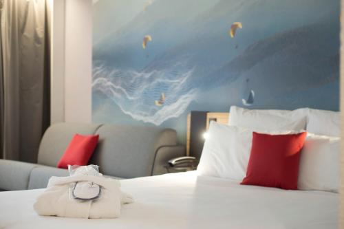 Postel nebo postele na pokoji v ubytování Novotel Clermont-Ferrand
