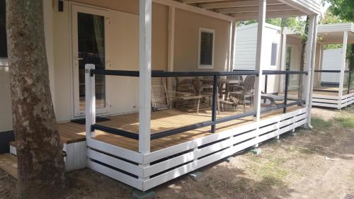 a deck on the side of a house at Victoria Mobilehome in Union Camping Cavallino in Cavallino-Treporti