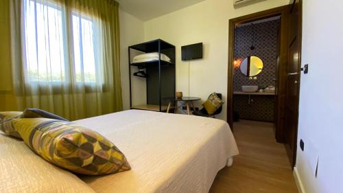 Katil atau katil-katil dalam bilik di La Tortorella Room & Apartment
