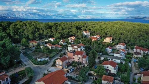 an aerial view of a town with houses and trees at Guest House Marinna in Vrboska