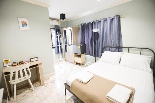 Ένα ή περισσότερα κρεβάτια σε δωμάτιο στο Wang Lang Hostel