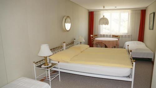 Postel nebo postele na pokoji v ubytování Hotel Beatus