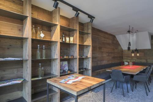 a dining room with wooden walls and a table and chairs at Innerbachlerhof - Mut in Postal