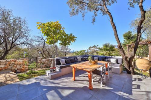 a patio with a couch and a table at Kale Lodge - Adult Only + 15 in Kas