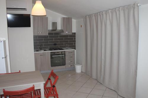 Kuchyň nebo kuchyňský kout v ubytování Case Così Apartments - Verona
