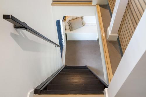 a staircase leading up to the basement of a house at The Slow in Zuidoostbeemster