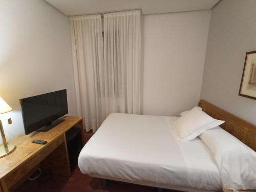 Postel nebo postele na pokoji v ubytování ARVA Spa París