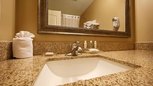 a bathroom with a sink and a mirror at Best Western Plus Fort Wayne Inn & Suites North in Fort Wayne