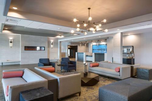 a lobby with couches and chairs in a building at Comfort Suites Kennewick at Southridge in Kennewick