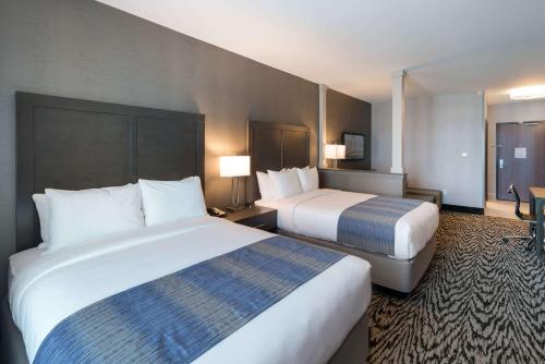 two beds in a hotel room with two at Comfort Suites Kennewick at Southridge in Kennewick