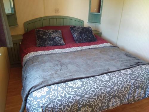 Katil atau katil-katil dalam bilik di Chalet plage Lomer