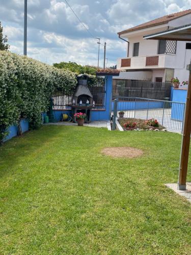 a backyard with a fireplace in a house at B&B Dolce Sogno in SantʼElpidio a Mare