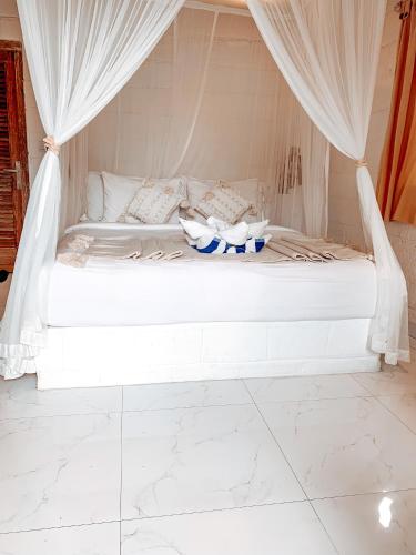 Кровать или кровати в номере Uluwatu Breeze Village