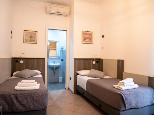 Postel nebo postele na pokoji v ubytování San Marco Hotel