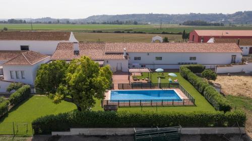 an aerial view of a house with a swimming pool at Quinta da Gafaria in Santarém