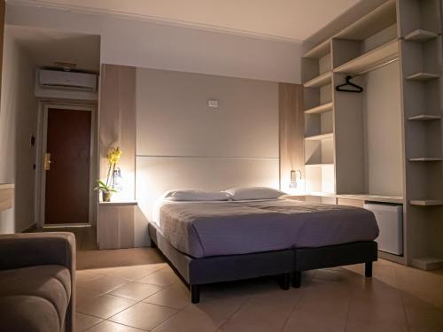 Postel nebo postele na pokoji v ubytování San Marco Hotel