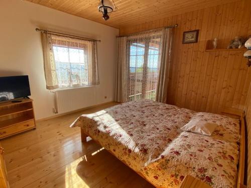 מיטה או מיטות בחדר ב-Luxusní horský apartmán v Beskydech
