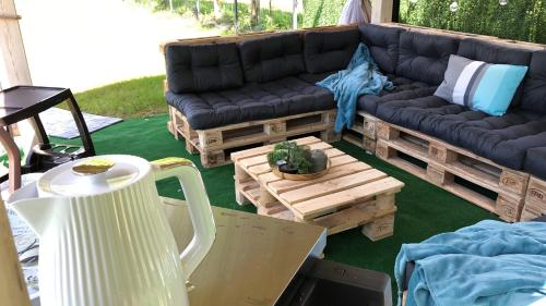 a living room with a couch and a coffee table at Comfort Zone Ostróda Ruś Mała in Ostróda