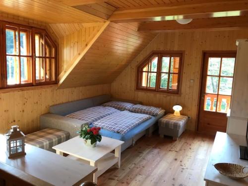 Un pat sau paturi într-o cameră la Drevenica Starý Mlyn