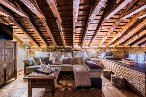 a living room with a couch and a table at Finca El Cotillo in Linares