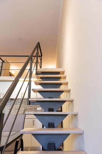a set of stairs in a building at Evdokia's Apartments and Rooms in Neos Marmaras