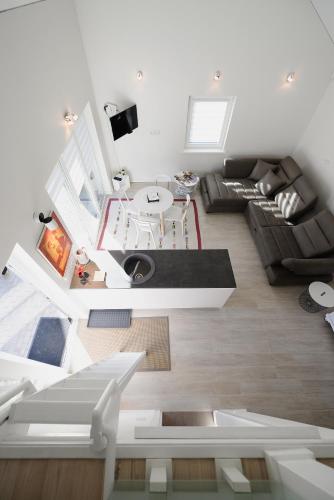 a living room with a couch and a table at FREGO house in Anykščiai