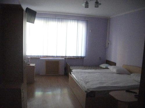 Ένα ή περισσότερα κρεβάτια σε δωμάτιο στο B&B Aktau НЕ ОТЕЛЬ