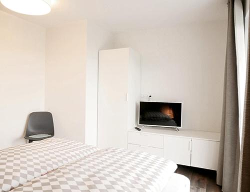 Łóżko lub łóżka w pokoju w obiekcie kleine Auszeit - der Ort zum Übernachten