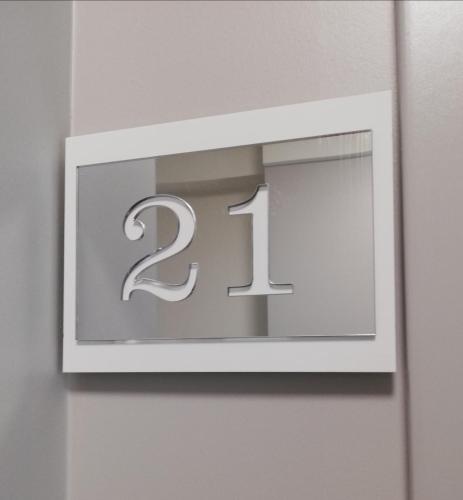 a lightswitch with the number on a wall at APARTAMENTY POSEJDON in Świnoujście